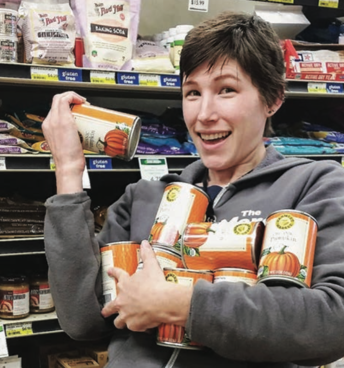 Grocery stocker with canned pumpkin